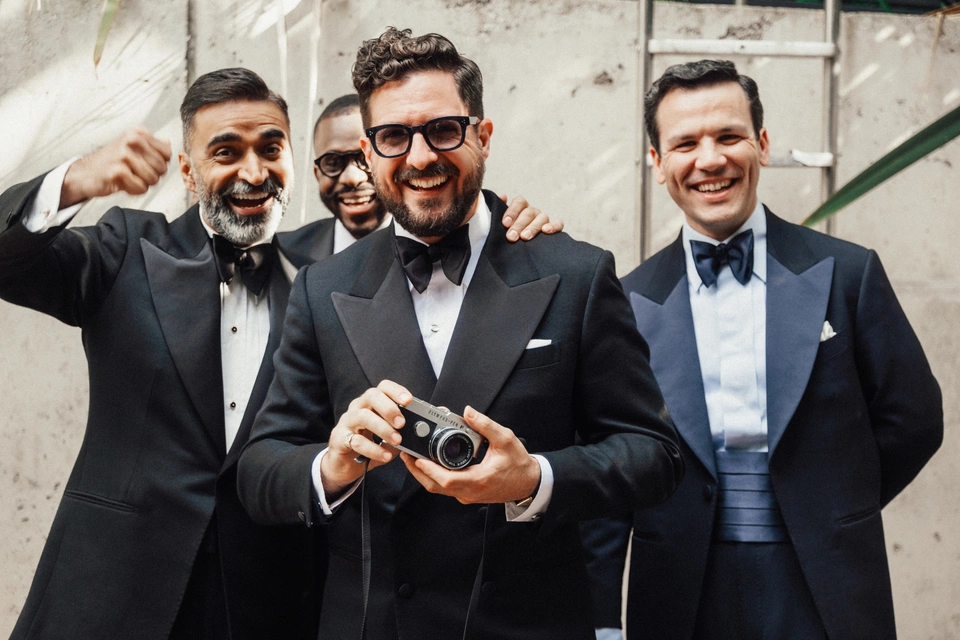 Group shot of gentlemen wearing la Bowtique black tie tailoring and bow ties